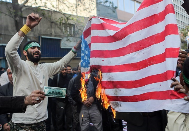 Iranian protesters burning US flag